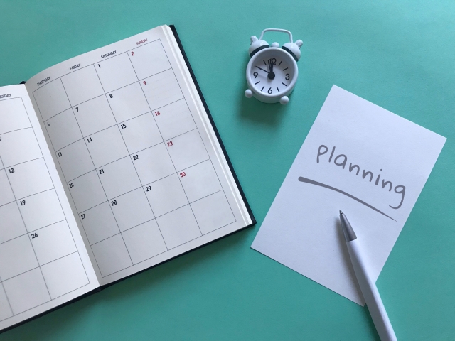 PLANNINGの文字列と手帳とボールペン